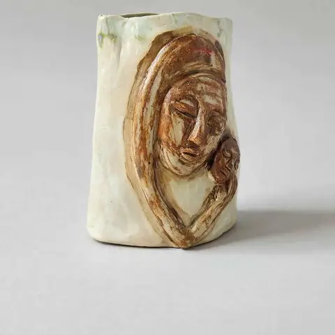 Mother and child relief vessel, bronze glaze