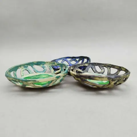 Trio of perforated bowls in green and blue