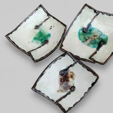 Trio of square dishes with teal glaze pools