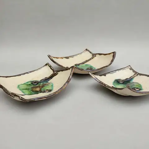 Trio of leaf-shaped dishes with green glaze accents
