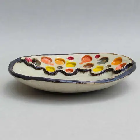 Elongated dish with confetti glaze drops