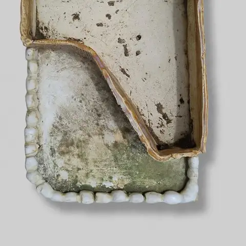 Detail of a rectangular tray with pebble border
